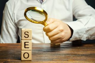 Page Speed and SEO, magnifying glass pointing to SEO word