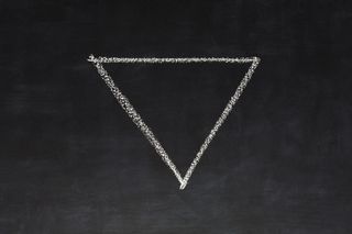 Triangle drawn with chalk on blackboard