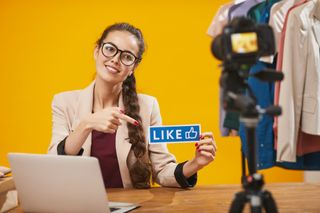 Social Media Influencer Holding Like, best hubspot features